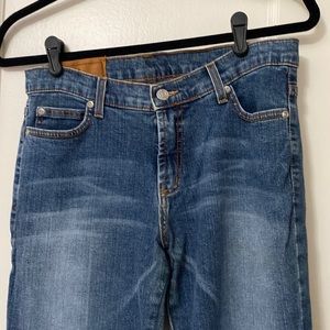 Rock and republic Vintage blue jeans with purple grommets. Comfortable boot cut.